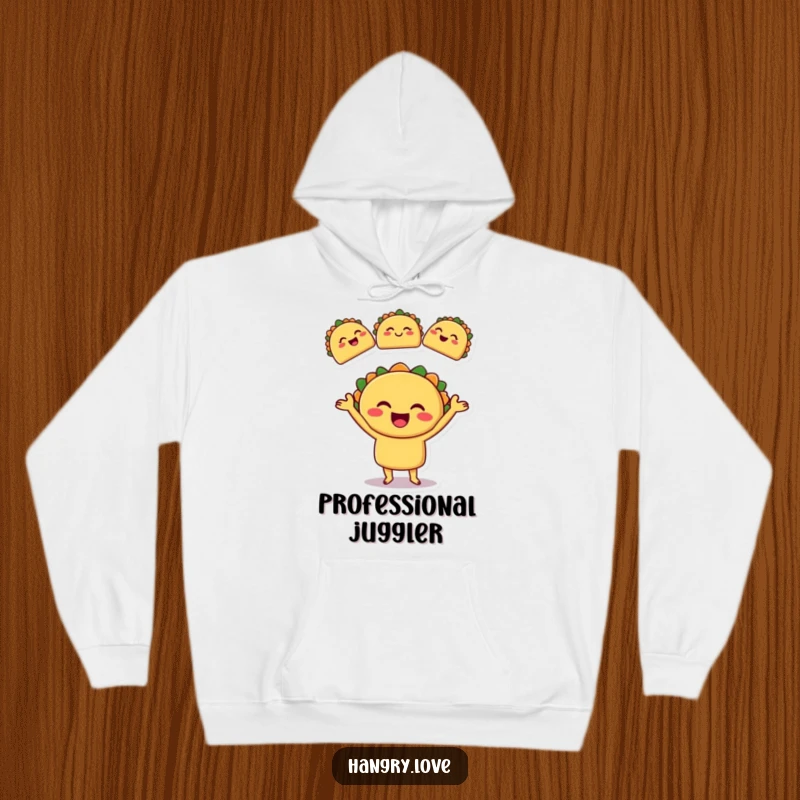 Funny hoodie displaying a smiling taco character mid-juggle with three tiny, winking tacos, perfect for food lovers.