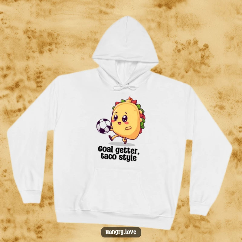 Funny taco hoodie, kawaii soccer player kicking a ball skyward, offering warmth and humorous sporty flair.